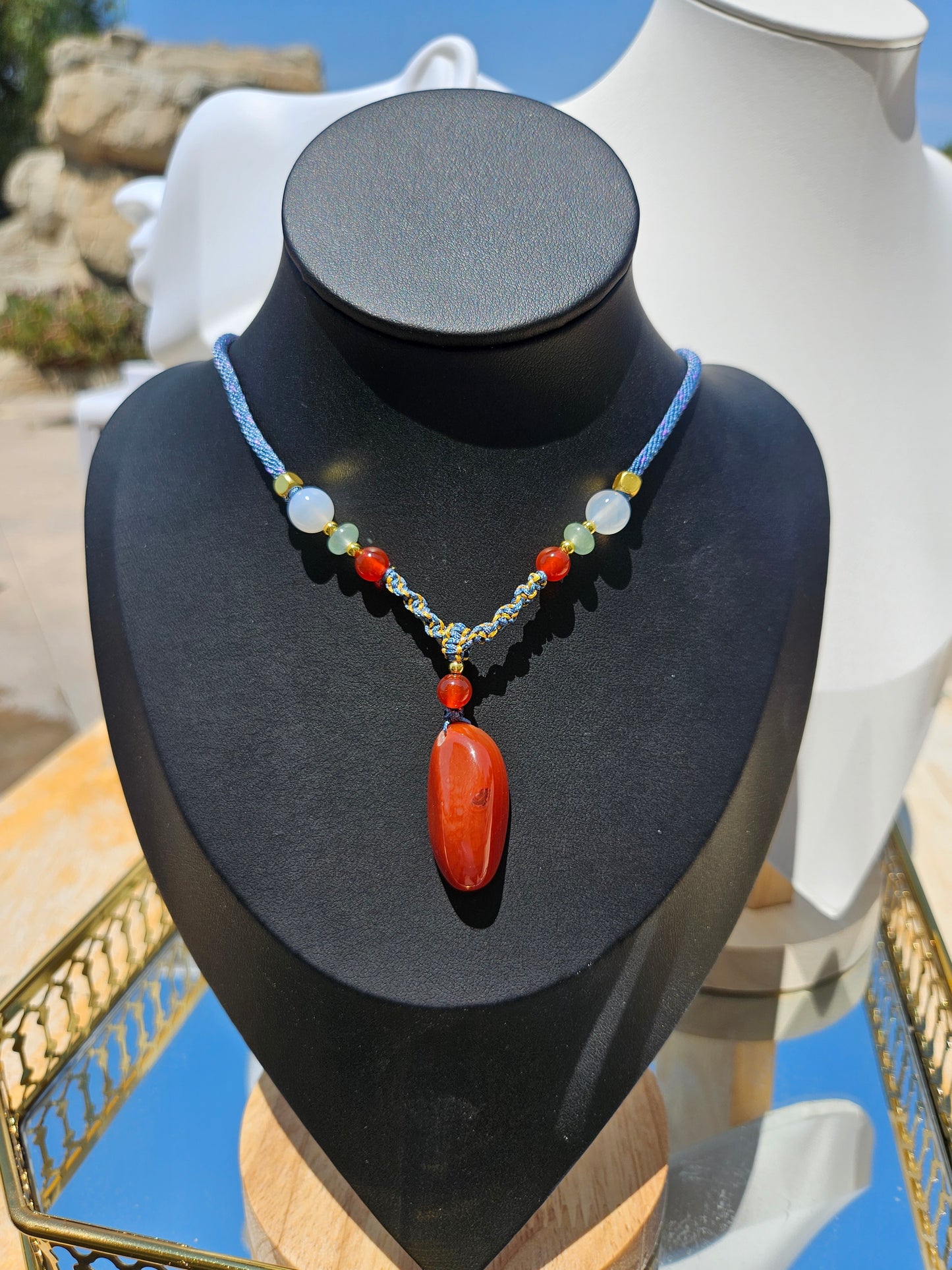 The natural agate pendant necklace has natural different textures on both sides