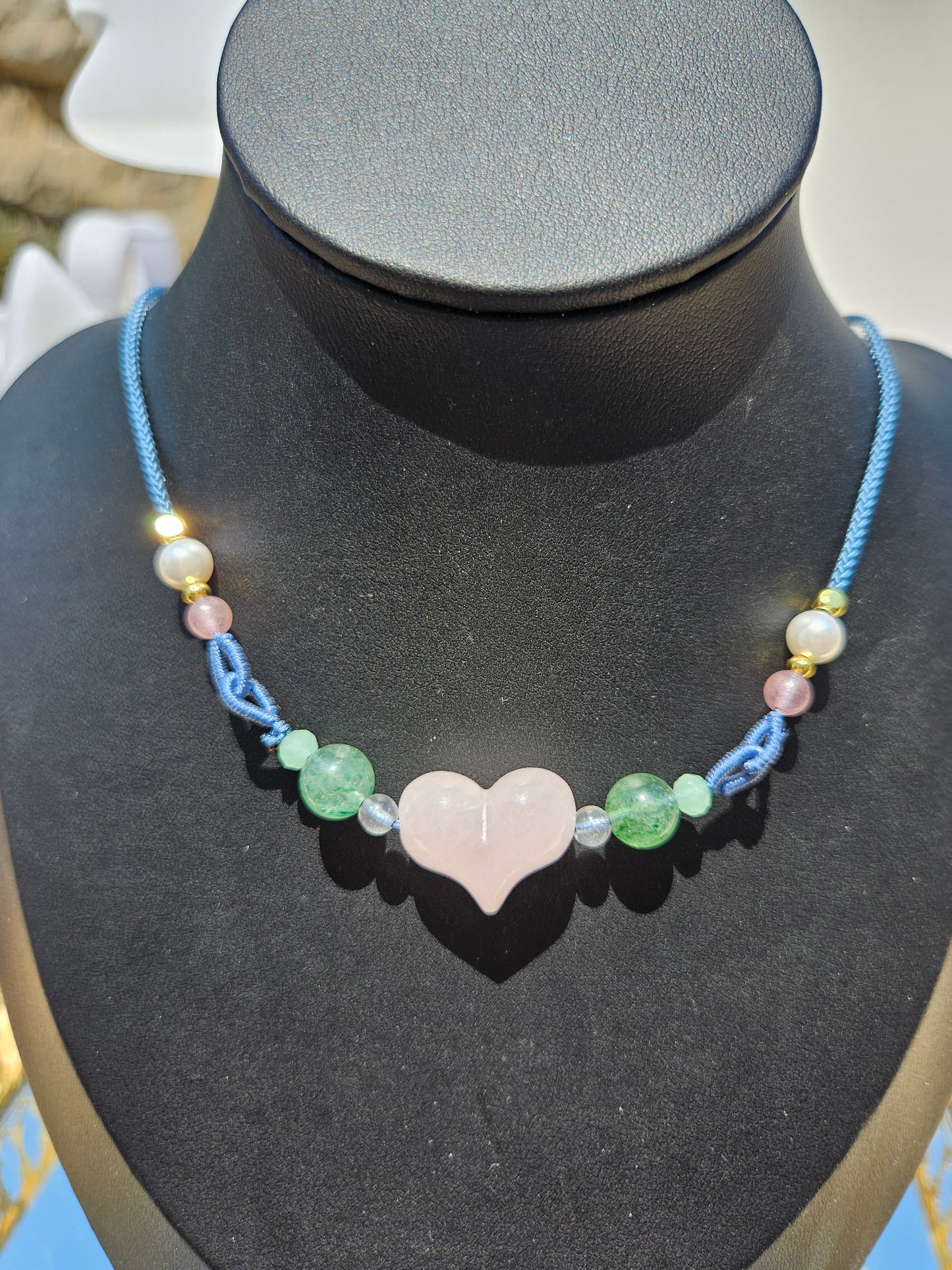 Natural rose quartz heart-shaped pendant necklace with hand-woven adjustable rope