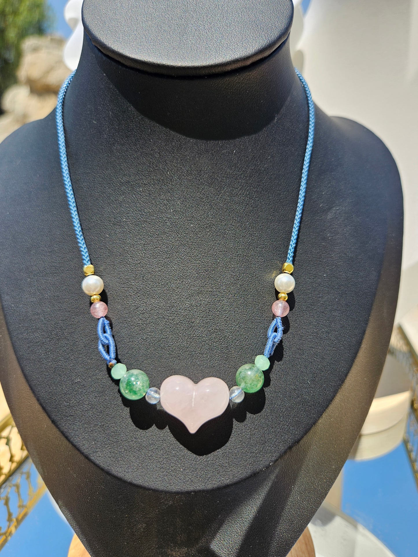 Natural rose quartz heart-shaped pendant necklace with hand-woven adjustable rope