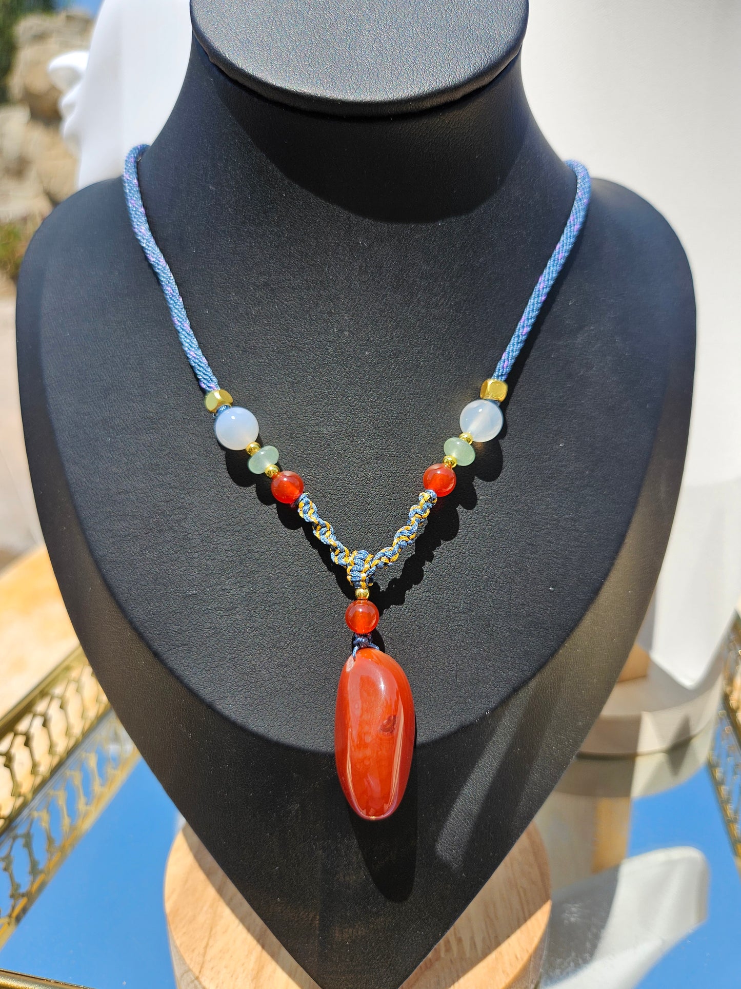 The natural agate pendant necklace has natural different textures on both sides